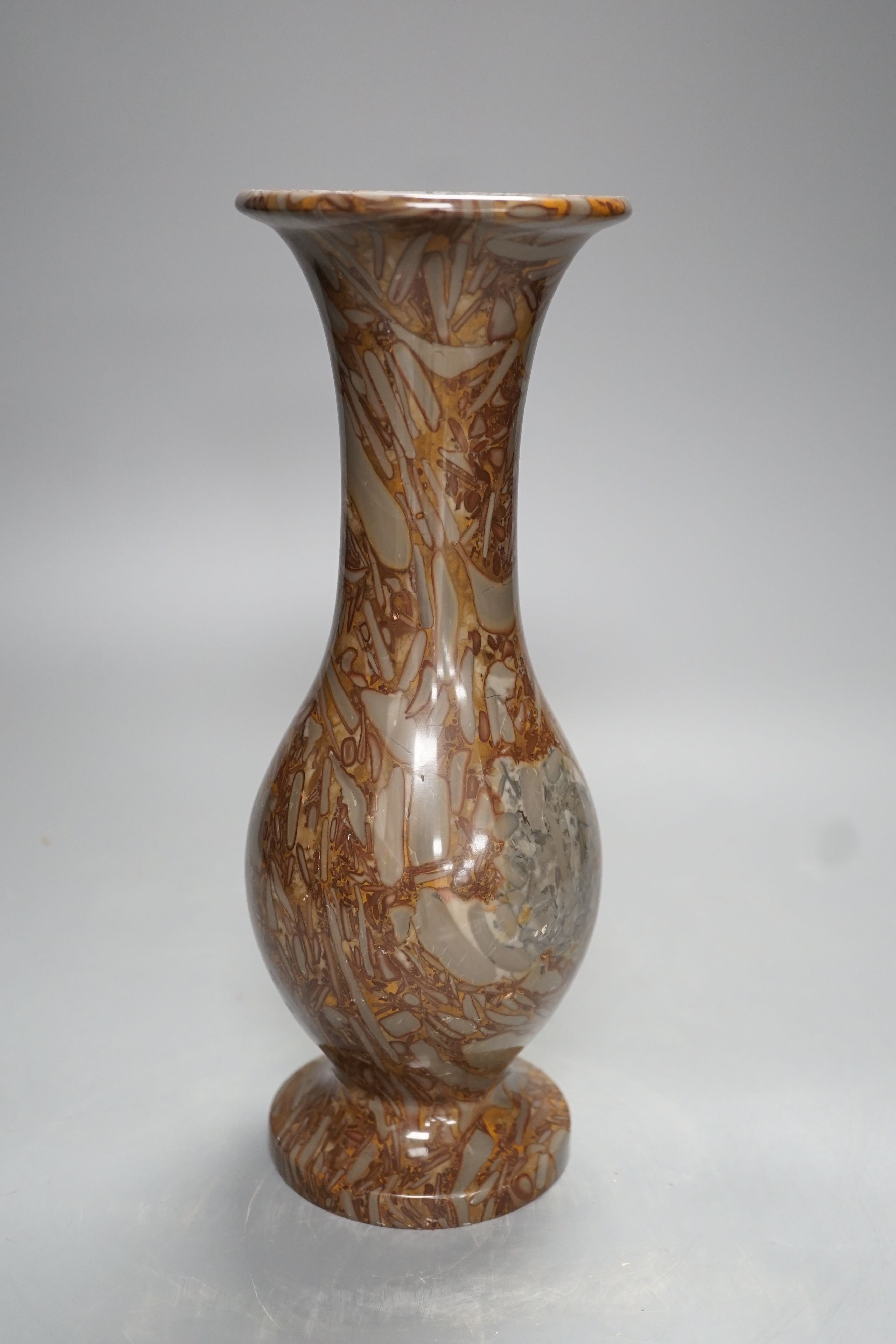 A pudding stone vase - 28cm high
